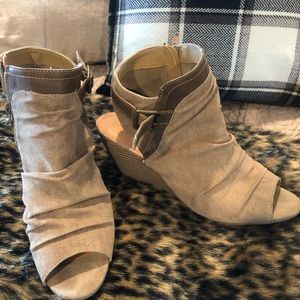 Super cuter wedge peep toe bootie.